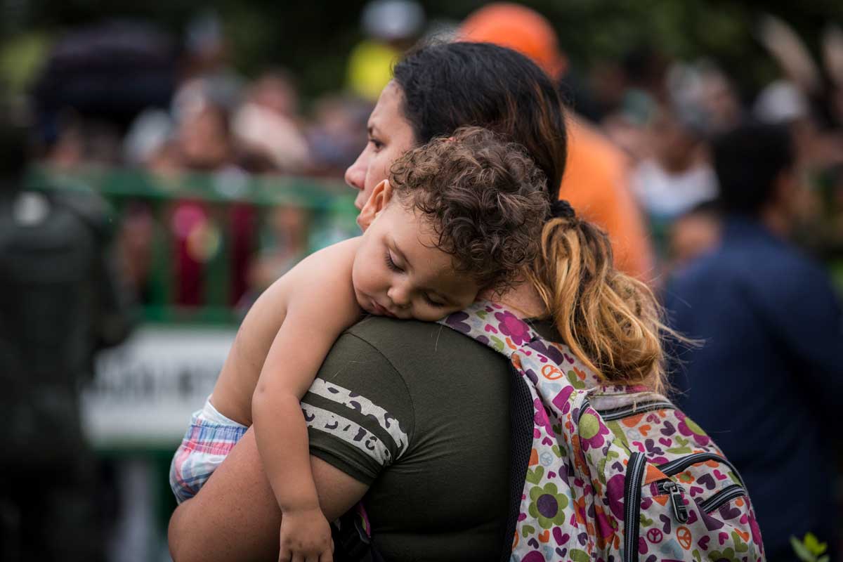 A mother holds her baby on Simon Bolivar Bridge. A mother holds her baby on Simon Bolivar Bridge.