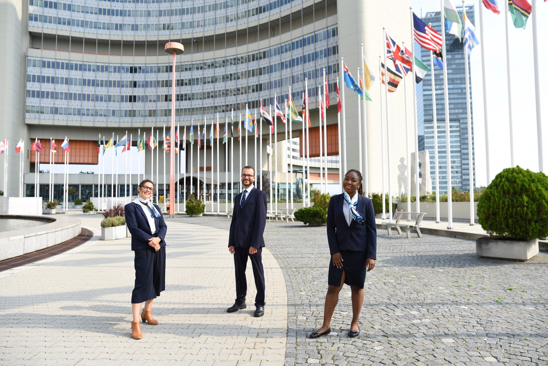 UN Vienna tour guides standing on the VIC Memorial Plaza UN Vienna tour guides standing on the VIC Memorial Plaza
